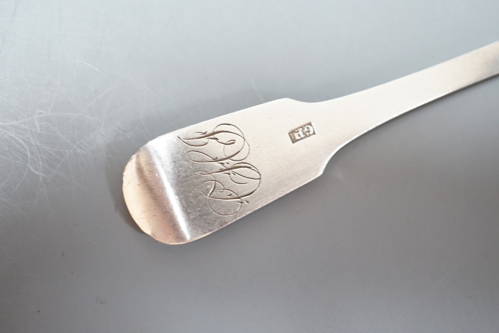 Twenty three items of continental white metal fiddle pattern flatware, stamped GH, including a soup ladle and marrow scoop